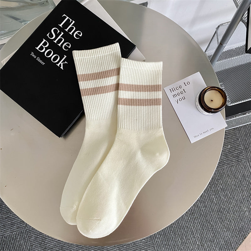 Women's mid-calf socks with two stripes.