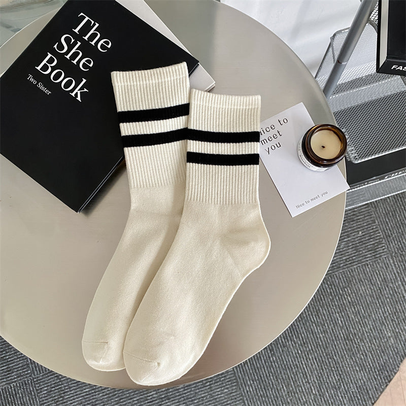 Women's mid-calf socks with two stripes.